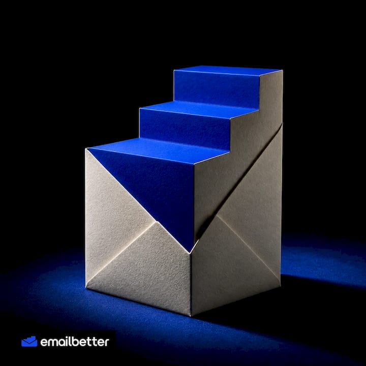 An ivory envelope unfolds into cobalt blue steps, a small step forward with every email.